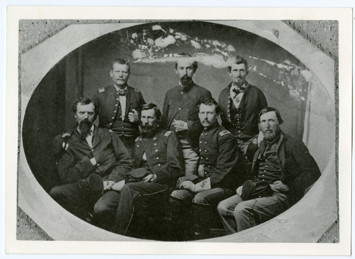 A sepia toned photo of members of the Colorado Cavalry, including Silas Soule and Edward Wynkoop