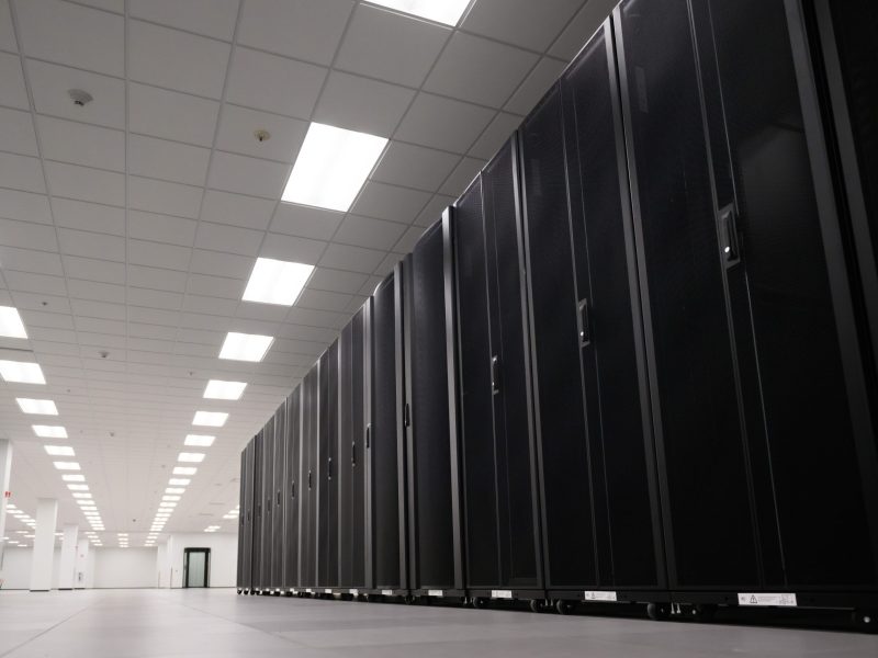 rows of cabinets holding computer drives in a data center