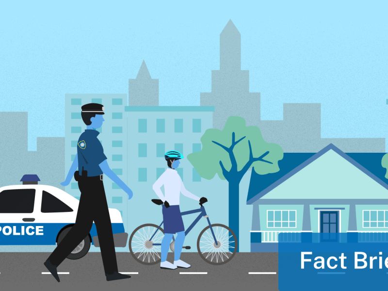 Graphic of a police car, policeman and bicyclist on a city street