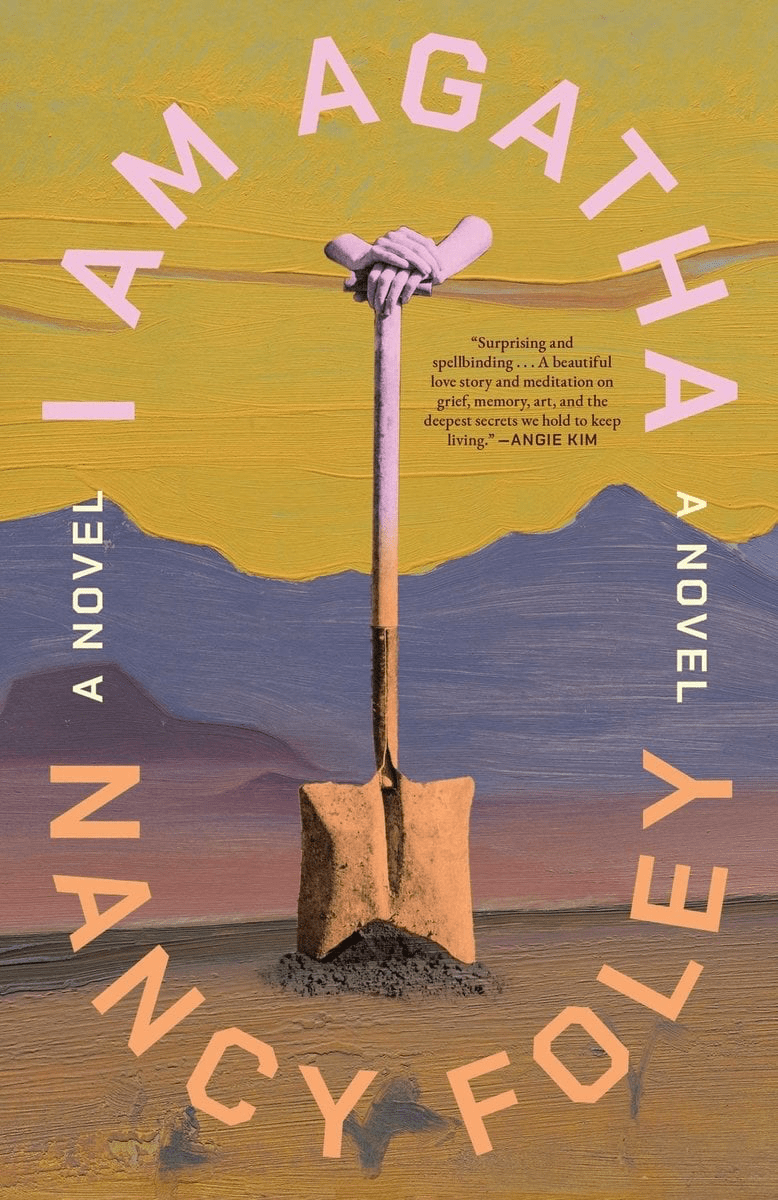 Book cover for "I Am Agatha" by Nancy Foley, featuring a pair of hands gripping a shovel planted in the ground against a desert landscape, with a quote by Angie Kim.
