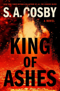 Book cover for "King of Ashes" by S.A. Cosby, featuring large bold text over an image of fire and ash erupting above train tracks at night.